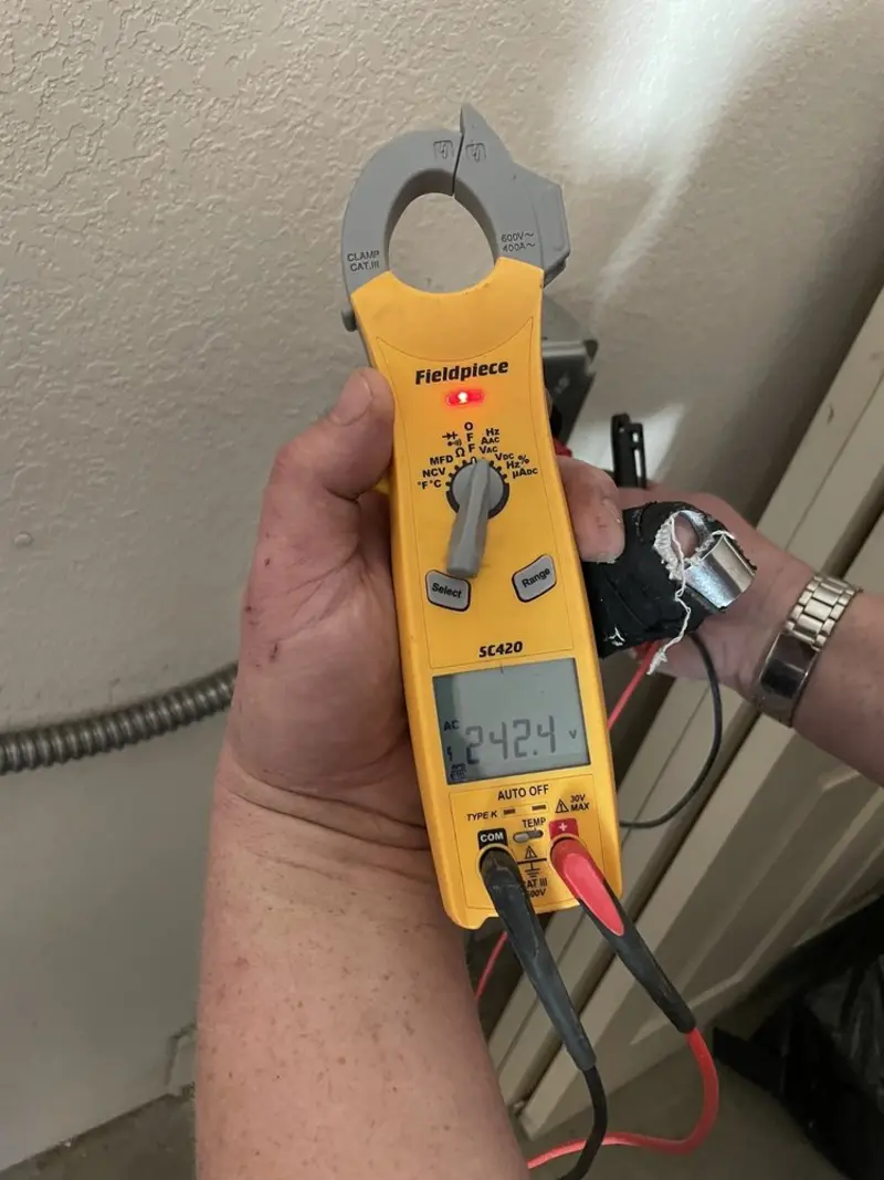 Voltage testing with clamp meter during Whole House Surge Protector in Gladewater